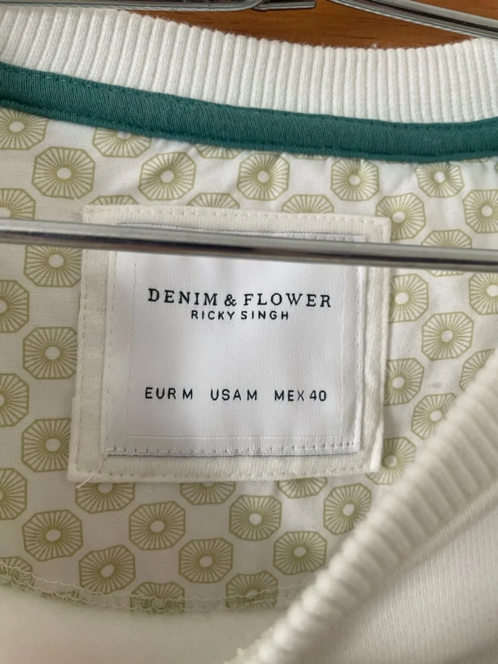 Denim & Flower White Crewneck Sweatshirt with Green Graphic Accents